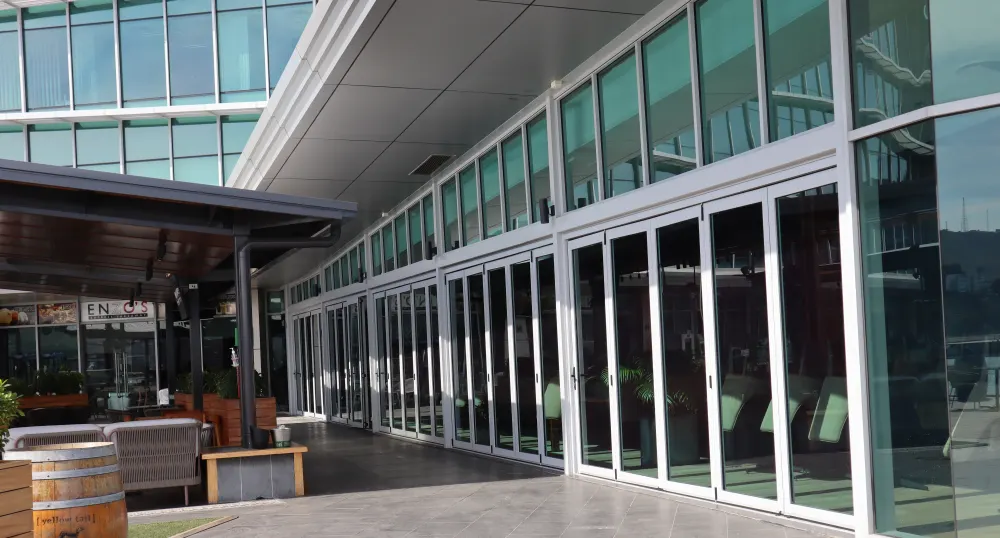 Glass shopfront and bi-folding doors at Alibi Bar and Grill